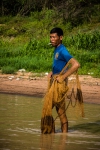 Fisherman studying the river