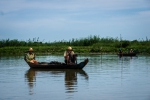 Two elder fishermen squatting and waiting