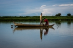 Two young fishermen fixing the fishnet