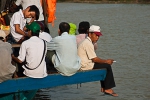 Sitting on the edge of a ferry platform