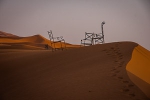 Chairs perched into sand