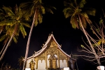 Wat Haw Pha Bang between the palm trees