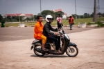 Lao Buddhist monk on a scooter