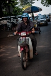 Lao currier on his Honda motorbike