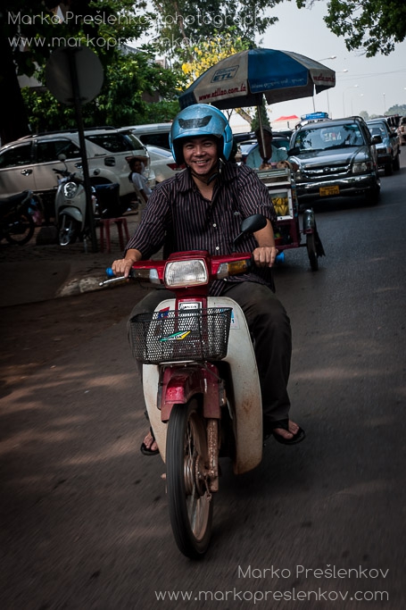 Lao currier on his Honda motorbike
