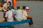 Sitting on the edge of a ferry platform