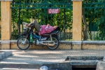 Sleeping on his Sanda motorbike