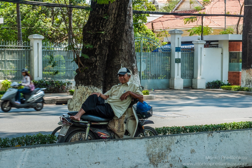 Lying on a motorbike in a shade