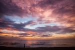 Children strolling on Sugar beach at sunset