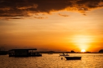 Sunset behind floating bar on Bounty Beach