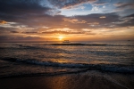 Sunset over a boat on Sugar beach