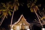 Wat Haw Pha Bang between the palm trees