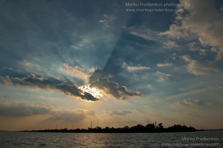 Sun rays over Mekong river island