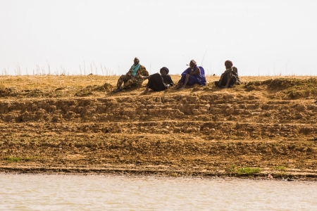Elders observing the river