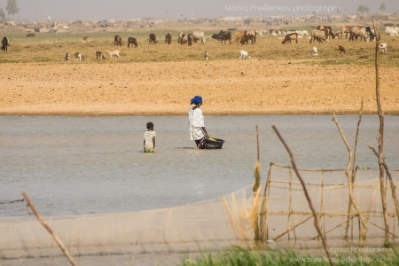 Girl and her mum in the river