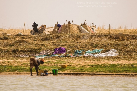 Washing dishes in Niger river