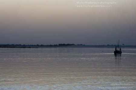 Pinasse in an evening mist